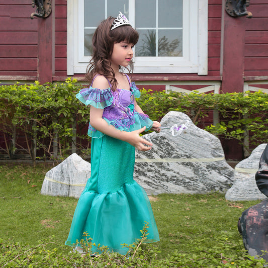 Mermaid gown in teal and purple with ruffle sleeves and waist with shell applique on girl. Organza bottom "tail".