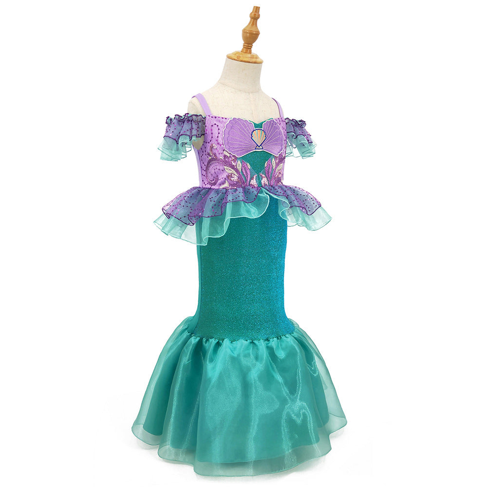 Mermaid gown in teal and purple with ruffle sleeves and waist with shell applique.